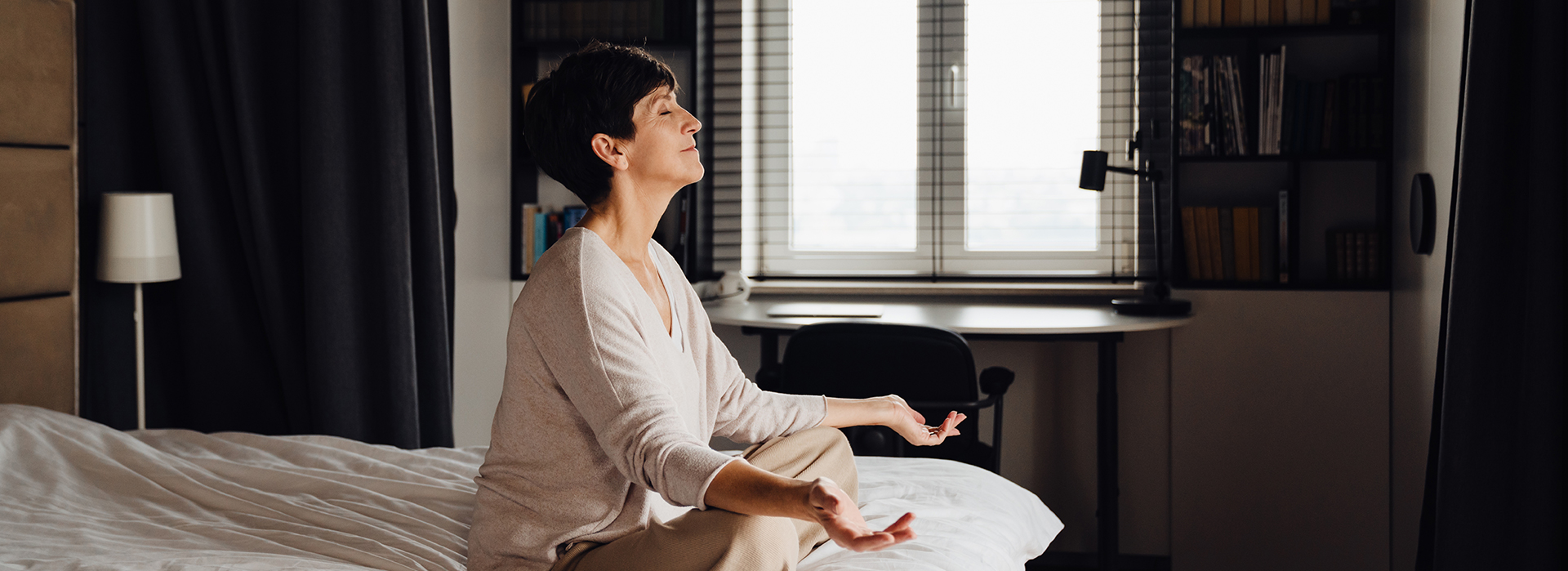 Lady meditating in bed
